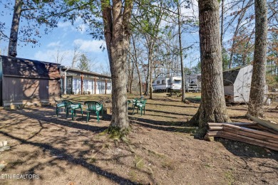 This lovely home on a one and a half lot provides ample privacy on Lake Tansi Village Country Club in Tennessee - for sale on GolfHomes.com, golf home, golf lot