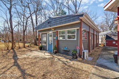 This lovely home on a one and a half lot provides ample privacy on Lake Tansi Village Country Club in Tennessee - for sale on GolfHomes.com, golf home, golf lot