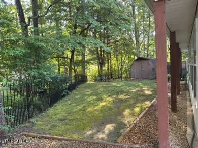 This lovely home on a one and a half lot provides ample privacy on Lake Tansi Village Country Club in Tennessee - for sale on GolfHomes.com, golf home, golf lot