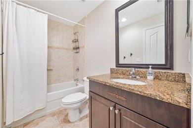 STUNNING, SPACIOUS 2ND-FLOOR END UNIT BOASTING NEARLY 2,000 on Gateway Golf and Country Club in Florida - for sale on GolfHomes.com, golf home, golf lot