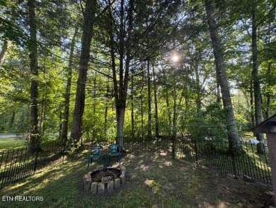 This lovely home on a one and a half lot provides ample privacy on Lake Tansi Village Country Club in Tennessee - for sale on GolfHomes.com, golf home, golf lot