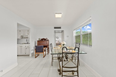 Enjoy lush garden and golf course views from this inviting on Kings Point Golf - Executive in Florida - for sale on GolfHomes.com, golf home, golf lot