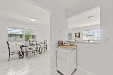 Enjoy lush garden and golf course views from this inviting on Kings Point Golf - Executive in Florida - for sale on GolfHomes.com, golf home, golf lot