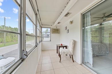 Enjoy lush garden and golf course views from this inviting on Kings Point Golf - Executive in Florida - for sale on GolfHomes.com, golf home, golf lot