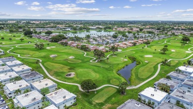 Enjoy lush garden and golf course views from this inviting on Kings Point Golf - Executive in Florida - for sale on GolfHomes.com, golf home, golf lot