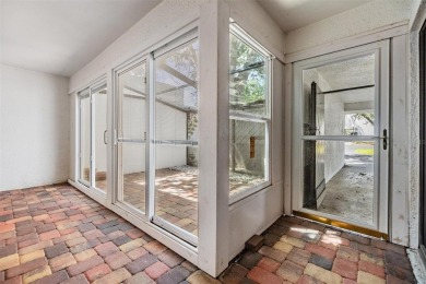 Welcome to this beautifully maintained 3-bedroom, 2-bathroom on Carrollwood Country Club in Florida - for sale on GolfHomes.com, golf home, golf lot