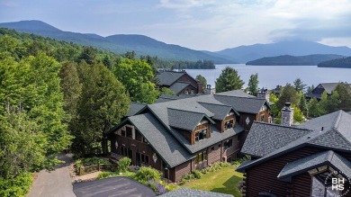 Discover unparalleled luxury in this stunning five-bedroom on Whiteface Club and Resort in New York - for sale on GolfHomes.com, golf home, golf lot