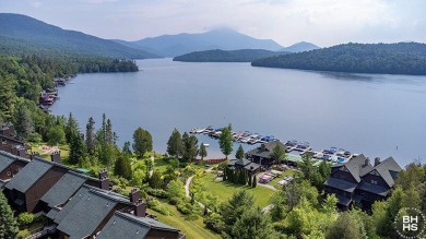 Discover unparalleled luxury in this stunning five-bedroom on Whiteface Club and Resort in New York - for sale on GolfHomes.com, golf home, golf lot