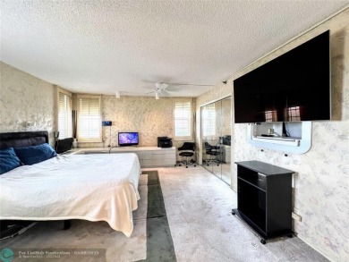 Located in the highly sought-after Palm Aire Country Club, this on Palm-Aire Country Club and Resort - Palms in Florida - for sale on GolfHomes.com, golf home, golf lot