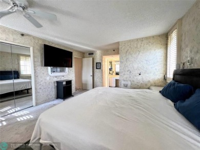 Located in the highly sought-after Palm Aire Country Club, this on Palm-Aire Country Club and Resort - Palms in Florida - for sale on GolfHomes.com, golf home, golf lot