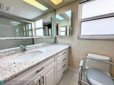 Located in the highly sought-after Palm Aire Country Club, this on Palm-Aire Country Club and Resort - Palms in Florida - for sale on GolfHomes.com, golf home, golf lot
