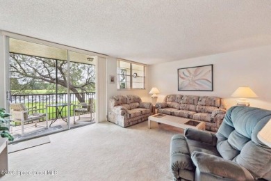 Wake up to lake and golf course views from this bright and on  in Florida - for sale on GolfHomes.com, golf home, golf lot