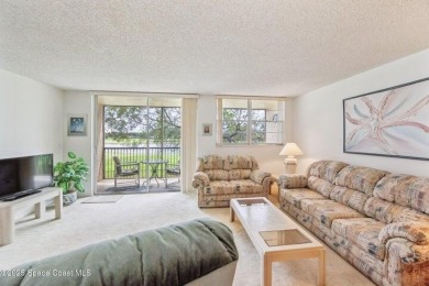 Wake up to lake and golf course views from this bright and on  in Florida - for sale on GolfHomes.com, golf home, golf lot