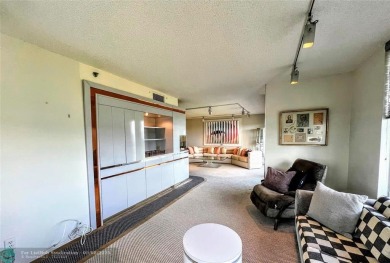 Located in the highly sought-after Palm Aire Country Club, this on Palm-Aire Country Club and Resort - Palms in Florida - for sale on GolfHomes.com, golf home, golf lot