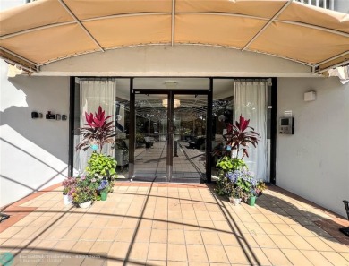 Located in the highly sought-after Palm Aire Country Club, this on Palm-Aire Country Club and Resort - Palms in Florida - for sale on GolfHomes.com, golf home, golf lot