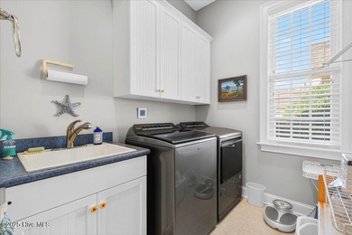 Welcome to your all-brick coastal retreat in the prestigious on Ocean Ridge Plantation in North Carolina - for sale on GolfHomes.com, golf home, golf lot