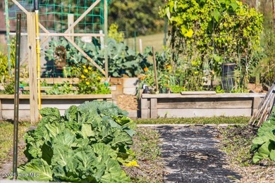 Welcome to your all-brick coastal retreat in the prestigious on Ocean Ridge Plantation in North Carolina - for sale on GolfHomes.com, golf home, golf lot