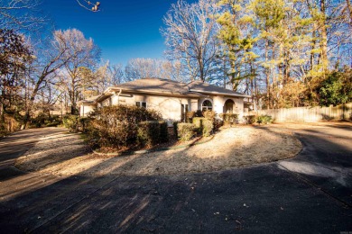 This stucco-built home is hitting the market! Featuring 4 on El Dorado Golf and Country Club in Arkansas - for sale on GolfHomes.com, golf home, golf lot