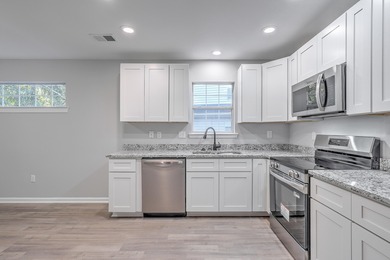 Discover this beautifully renovated home and nestled in one of on Golf Club At Wescott Plantation in South Carolina - for sale on GolfHomes.com, golf home, golf lot