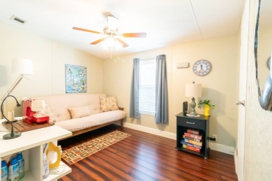 Nestled within the welcoming embrace of Whispering Pines in on Lily Lake Golf and RV Resort in Florida - for sale on GolfHomes.com, golf home, golf lot