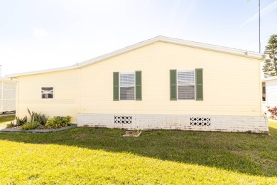 Nestled within the welcoming embrace of Whispering Pines in on Lily Lake Golf and RV Resort in Florida - for sale on GolfHomes.com, golf home, golf lot