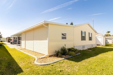 Nestled within the welcoming embrace of Whispering Pines in on Lily Lake Golf and RV Resort in Florida - for sale on GolfHomes.com, golf home, golf lot