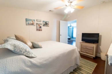 Nestled within the welcoming embrace of Whispering Pines in on Lily Lake Golf and RV Resort in Florida - for sale on GolfHomes.com, golf home, golf lot