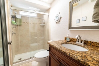 Nestled within the welcoming embrace of Whispering Pines in on Lily Lake Golf and RV Resort in Florida - for sale on GolfHomes.com, golf home, golf lot