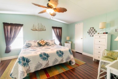 Nestled within the welcoming embrace of Whispering Pines in on Lily Lake Golf and RV Resort in Florida - for sale on GolfHomes.com, golf home, golf lot