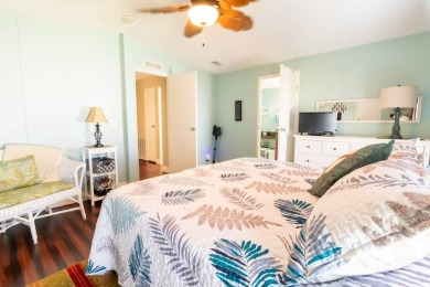 Nestled within the welcoming embrace of Whispering Pines in on Lily Lake Golf and RV Resort in Florida - for sale on GolfHomes.com, golf home, golf lot