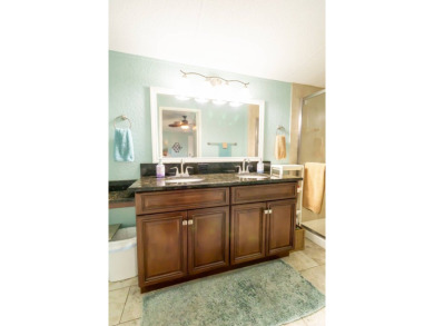Nestled within the welcoming embrace of Whispering Pines in on Lily Lake Golf and RV Resort in Florida - for sale on GolfHomes.com, golf home, golf lot