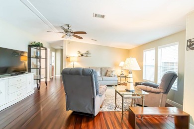 Nestled within the welcoming embrace of Whispering Pines in on Lily Lake Golf and RV Resort in Florida - for sale on GolfHomes.com, golf home, golf lot
