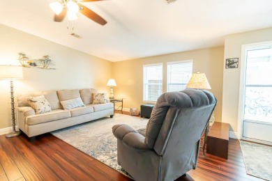 Nestled within the welcoming embrace of Whispering Pines in on Lily Lake Golf and RV Resort in Florida - for sale on GolfHomes.com, golf home, golf lot