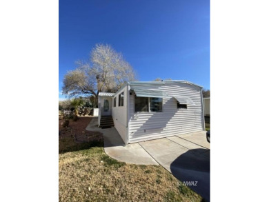 This manufactured home in Beaver Dam Resorts is an inviting on Beaver Dam Resort in Arizona - for sale on GolfHomes.com, golf home, golf lot