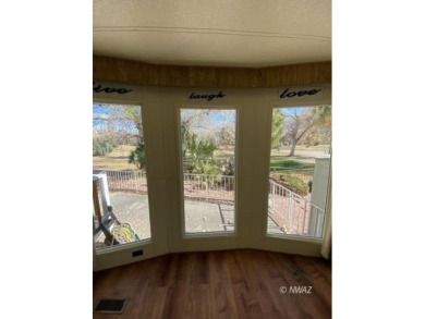 This manufactured home in Beaver Dam Resorts is an inviting on Beaver Dam Resort in Arizona - for sale on GolfHomes.com, golf home, golf lot