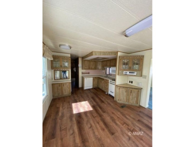 This manufactured home in Beaver Dam Resorts is an inviting on Beaver Dam Resort in Arizona - for sale on GolfHomes.com, golf home, golf lot