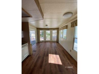 This manufactured home in Beaver Dam Resorts is an inviting on Beaver Dam Resort in Arizona - for sale on GolfHomes.com, golf home, golf lot