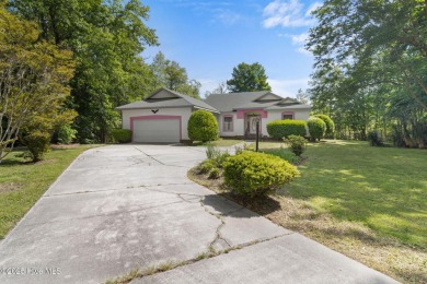 Welcome home to this cozy custom-built ranch nestled in the on Sound Golf Links at Albemarle Plantation in North Carolina - for sale on GolfHomes.com, golf home, golf lot