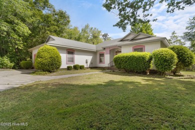 Welcome home to this cozy custom-built ranch nestled in the on Sound Golf Links at Albemarle Plantation in North Carolina - for sale on GolfHomes.com, golf home, golf lot