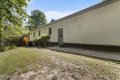 Welcome home to this cozy custom-built ranch nestled in the on Sound Golf Links at Albemarle Plantation in North Carolina - for sale on GolfHomes.com, golf home, golf lot