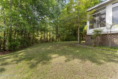 Welcome home to this cozy custom-built ranch nestled in the on Sound Golf Links at Albemarle Plantation in North Carolina - for sale on GolfHomes.com, golf home, golf lot