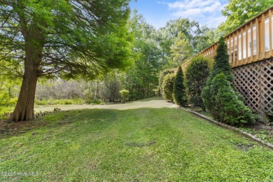 Welcome home to this cozy custom-built ranch nestled in the on Sound Golf Links at Albemarle Plantation in North Carolina - for sale on GolfHomes.com, golf home, golf lot