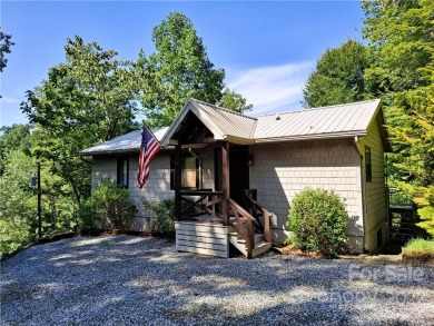 Charmingly updated & secluded 2BR + flex/guest room, 2BA on Rumbling Bald Resort on Lake Lure in North Carolina - for sale on GolfHomes.com, golf home, golf lot