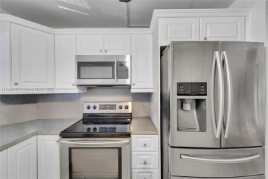 Updated custom kitchen, bathroom and floors, beautiful view of on Sunrise Lakes Phase III in Florida - for sale on GolfHomes.com, golf home, golf lot