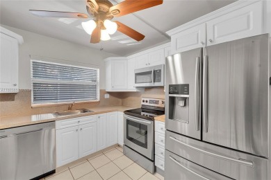 Updated custom kitchen, bathroom and floors, beautiful view of on Sunrise Lakes Phase III in Florida - for sale on GolfHomes.com, golf home, golf lot