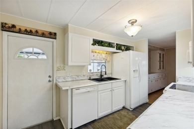 Welcome to Barefoot Bay! This cozy 2 bedroom, 2 bath home is on Barefoot Bay Golf Course in Florida - for sale on GolfHomes.com, golf home, golf lot