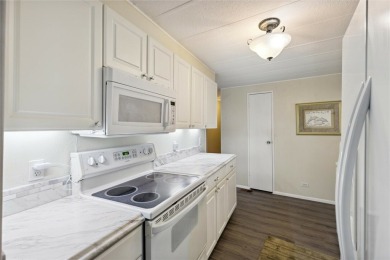 Welcome to Barefoot Bay! This cozy 2 bedroom, 2 bath home is on Barefoot Bay Golf Course in Florida - for sale on GolfHomes.com, golf home, golf lot