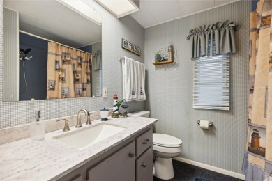 Welcome to Barefoot Bay! This cozy 2 bedroom, 2 bath home is on Barefoot Bay Golf Course in Florida - for sale on GolfHomes.com, golf home, golf lot
