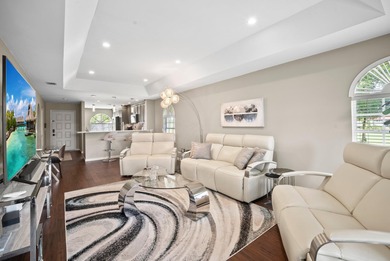 Enjoy sipping your morning coffee from the lanai of this on Royal Palm Golf Club in Florida - for sale on GolfHomes.com, golf home, golf lot