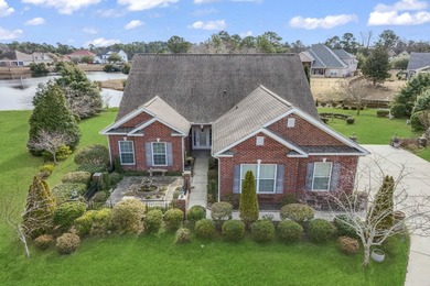 This stunning lakefront home sits perfectly on a peaceful on Wild Wing Plantation in South Carolina - for sale on GolfHomes.com, golf home, golf lot